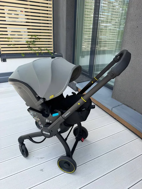 Doona X автокресло-коляска 2в1 + база ISOFIX (серый/чёрный, комплект)